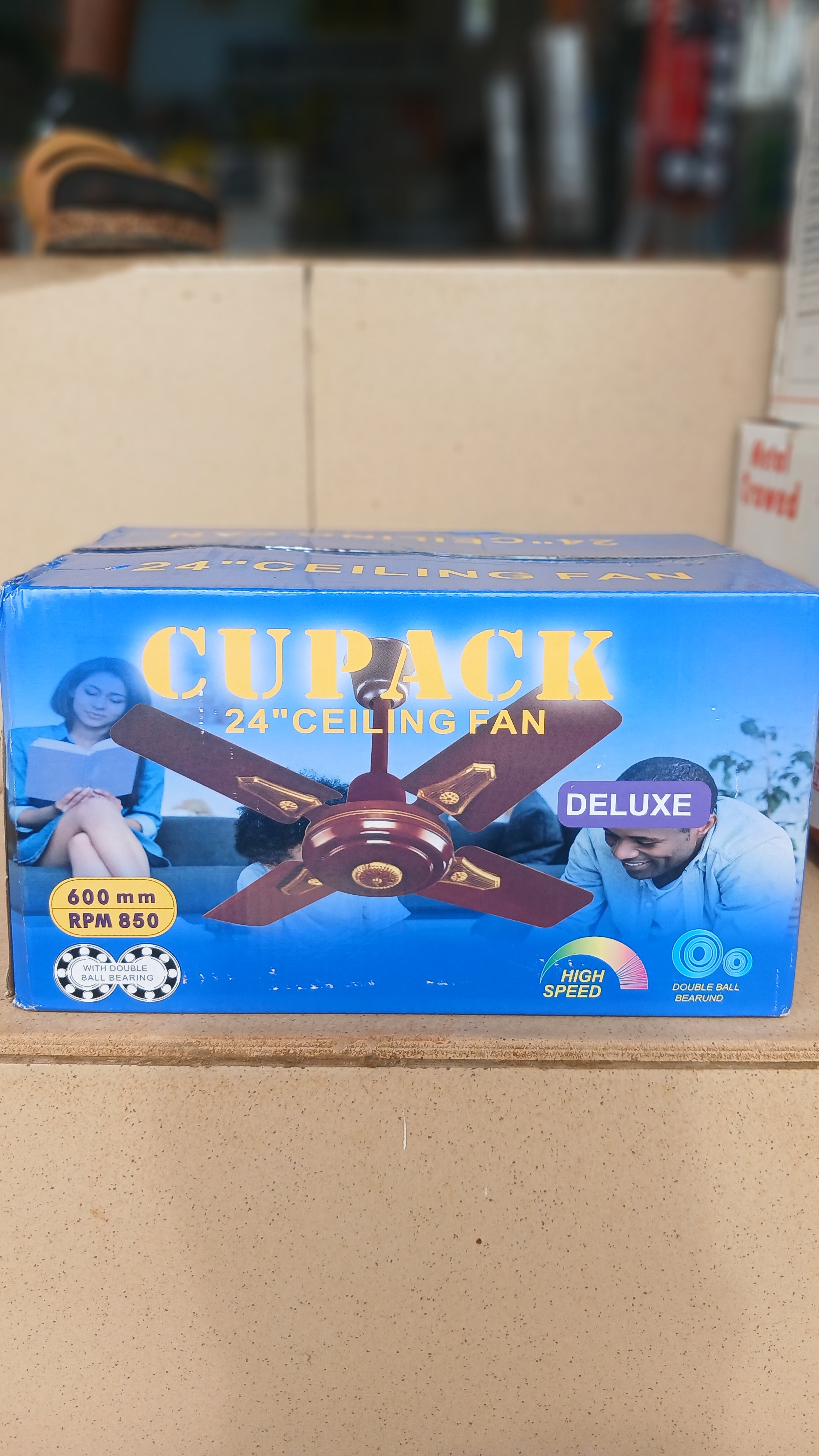 Cupack 24" Deluxe Ceiling Fan is a compact 4-blade fan designed for smaller spaces, featuring a white finish with gold accents and a sweep size of 600 mm.