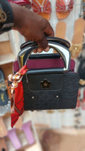 black faux leather handbag with silver handles