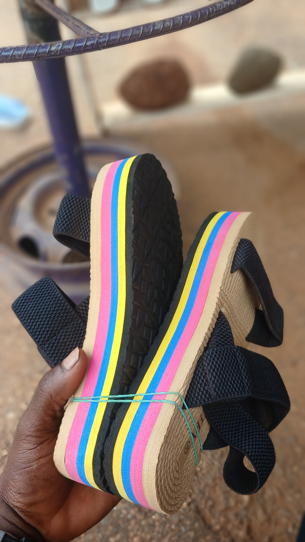 braided straw-style sole and elastic black straps sandals