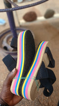 braided straw-style sole and elastic black straps sandals