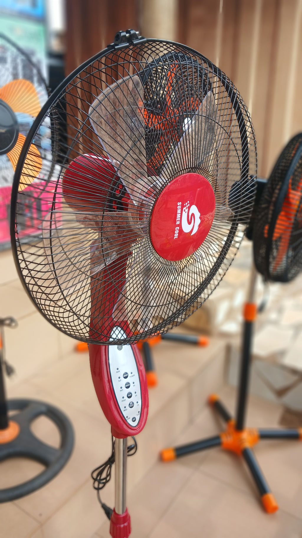 Summer Cool rechargeable pedestal fan,with remote control designed for cooling without reliance on the electrical grid