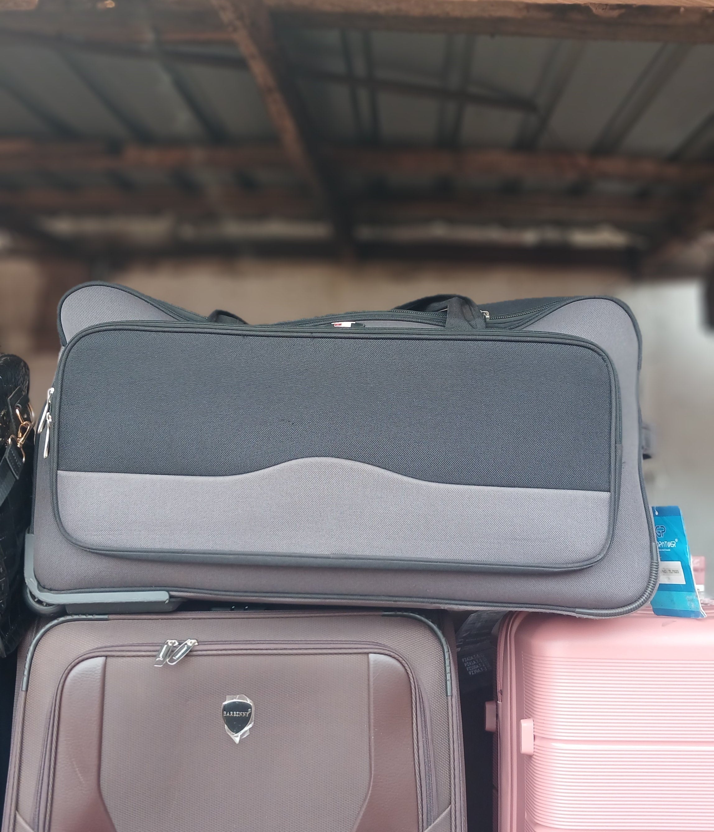 Goodpartner branded trolling traveling bag in black and gray.