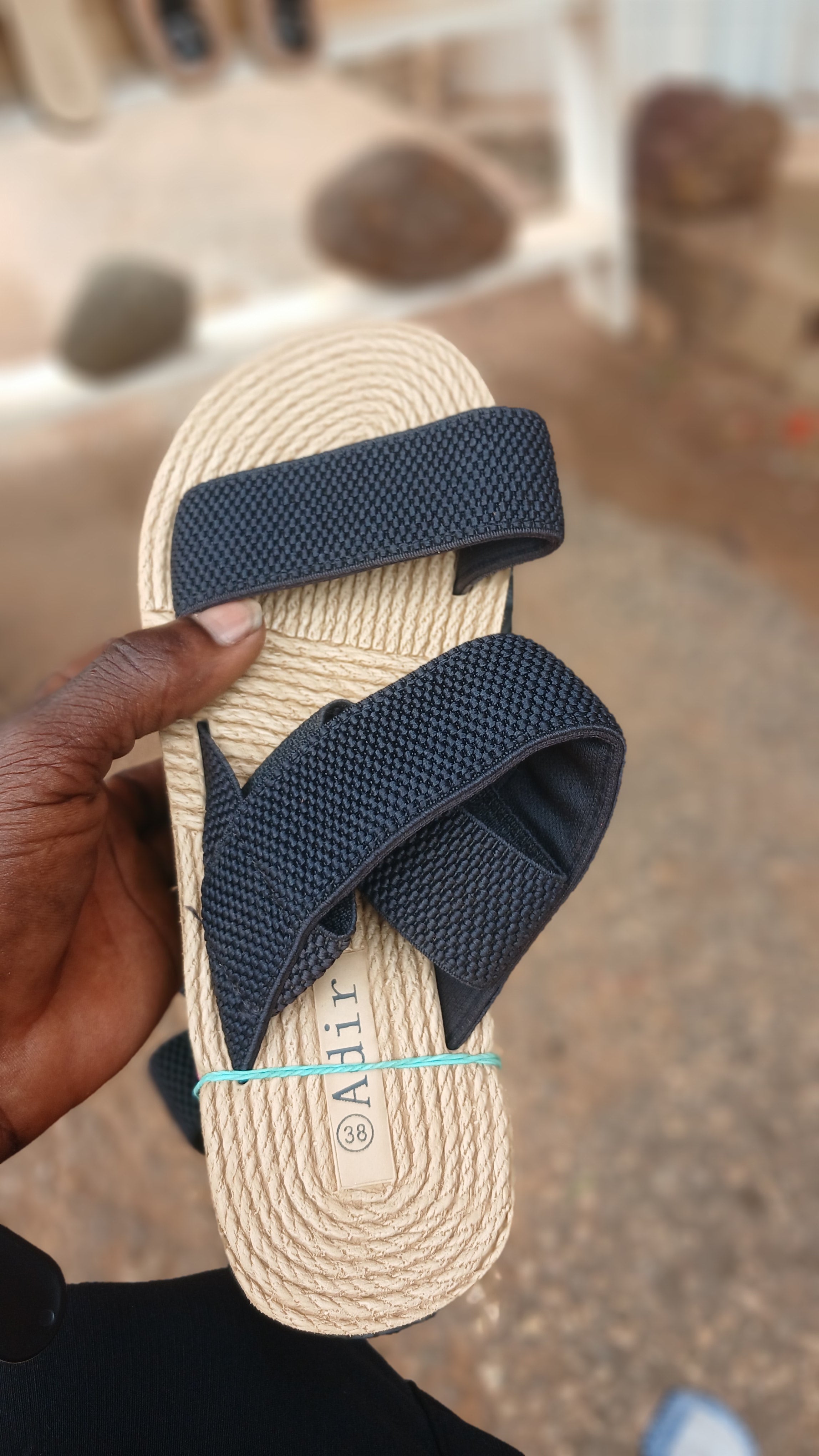 braided straw-style sole and elastic black straps sandals